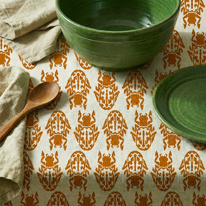 Insect Rust on Beige Tablecloth